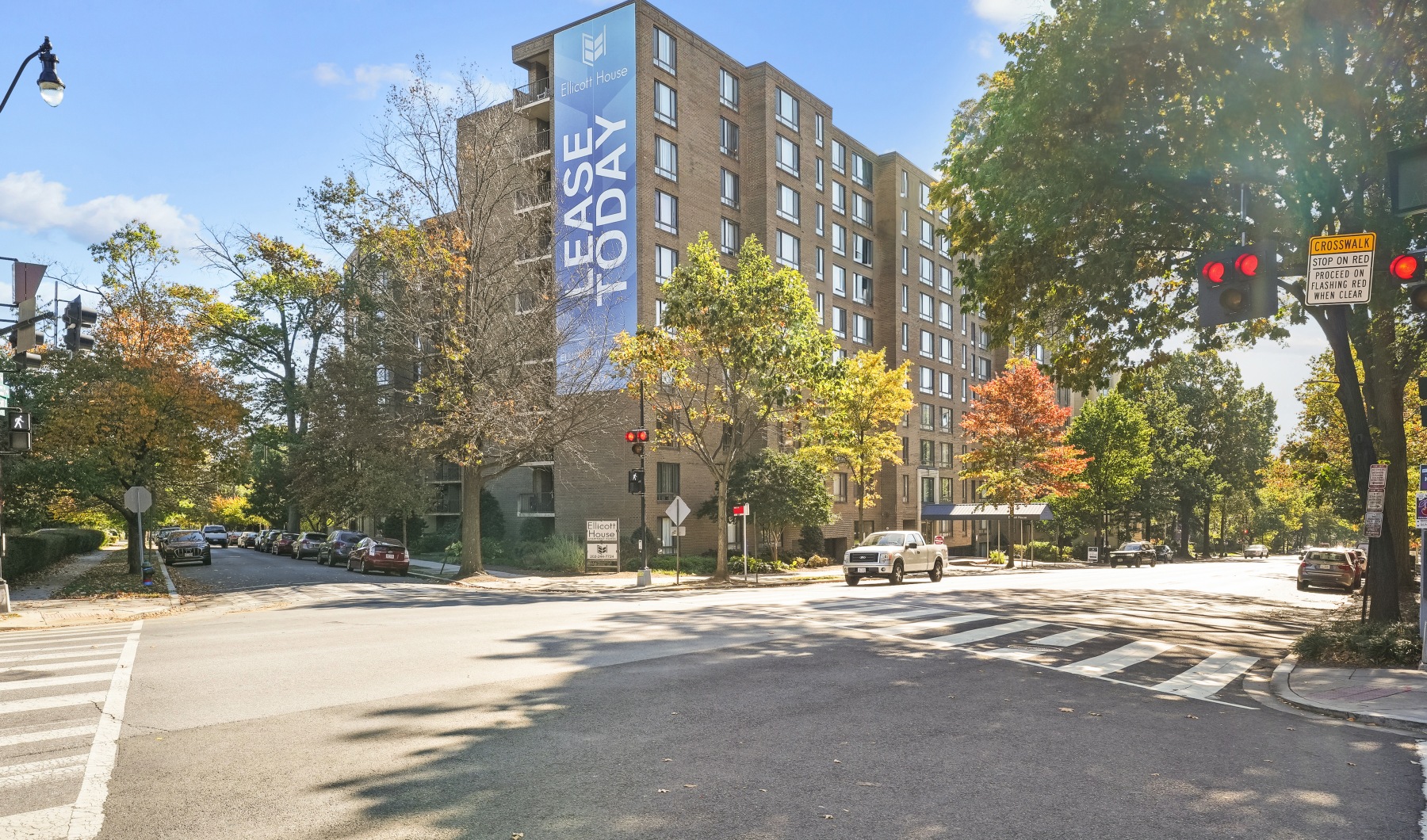 Building exterior with trees and street