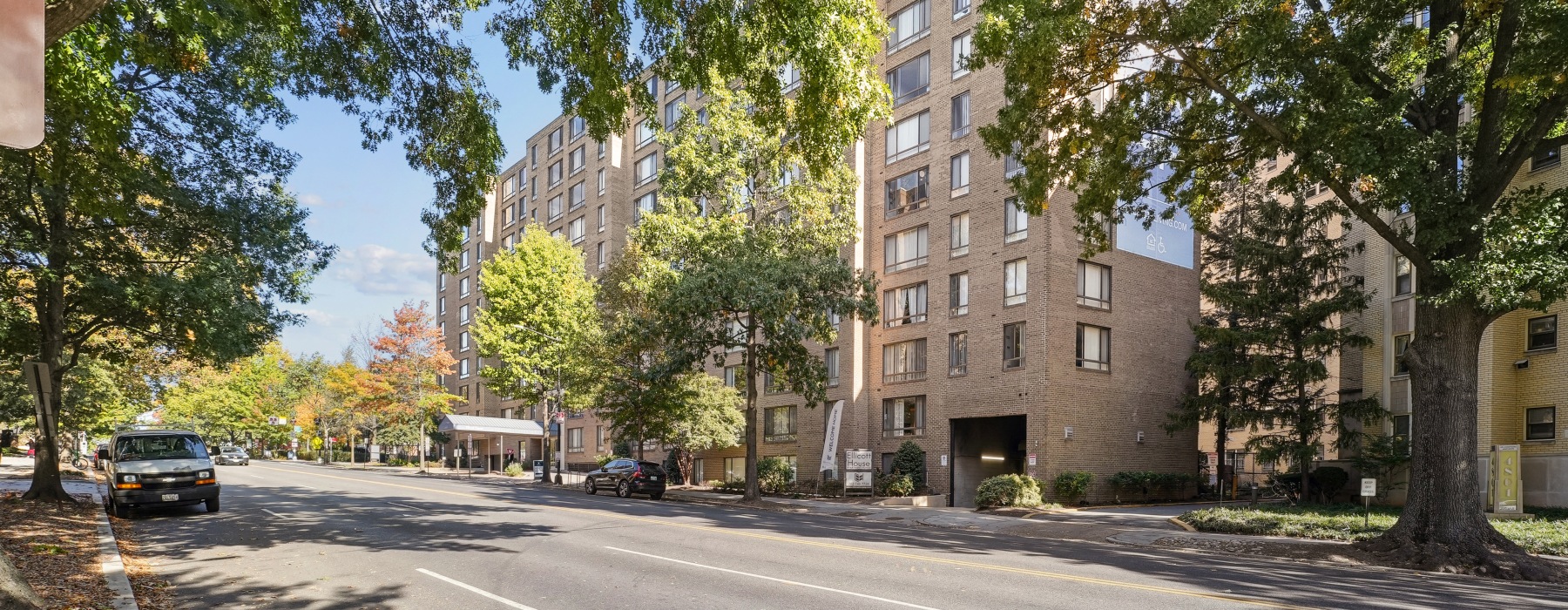 Building exterior with trees and street