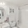 bathroom with tile shower tub combo 